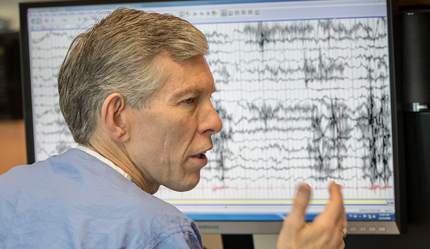 Neuroscience Physician, Dr. James Wheless monitoring an epilepsy patient who has a VNS device.